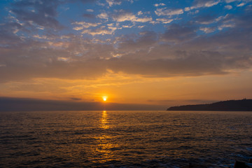 Naklejka na ściany i meble Unique sea sunrise from the port of Varna.