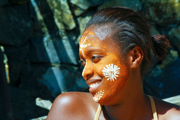 Woman with traditionally painted face, Madagascar