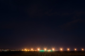 Fototapeta na wymiar Lights from the airport at late night.