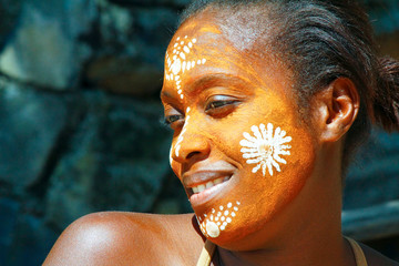 Woman with traditionally painted face, Madagascar