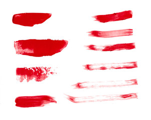 Red makeup smear of lip gloss isolated on white background. Red lipstick texture isolated on white background