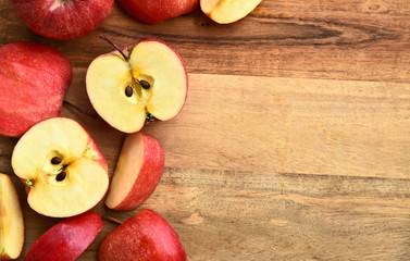 Top view a lot of  fresh Gala red apple isolated on wooden background with space for text.
