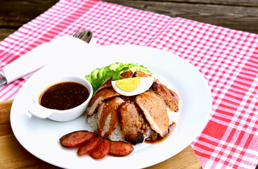 Barbecued red pork in sauce with rice..Thai Pork Menu.