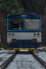 Fototapeta premium Merklin station in Krusne mountains in winter dark day with diesel blue train