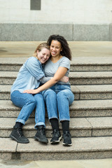 Happy lesbian couple sitting together