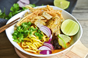 Chiang Mai Curried noodle soup with Pork spare ribs (Thai name is Khao Soi or Khao Sawy).Northern Thai food menu.