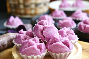 Purple Sweet Potato Steam Muffins on wooden broad..purple sweet potatoes desert menu.