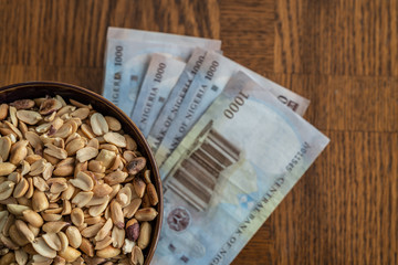 Nigerian Roasted Groundnuts Peanuts with Nigerian Naira Notes