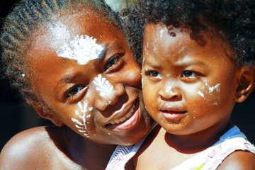 Girl with traditionally painted face, Madagascar