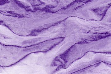 Elegant violet textile background. Silk cloth texture. Fabric pattern.