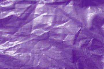 Obraz premium Elegant violet textile background. Silk cloth texture. Fabric pattern.