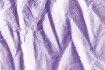 Elegant violet textile background. Silk cloth texture. Fabric pattern.