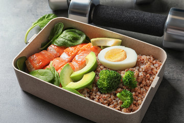 Container with natural healthy lunch on table. High protein food © New Africa