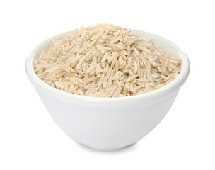 Bowl with raw unpolished rice on white background