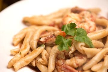 Delicious home made pasta with shrimps. Sicily food on white plate