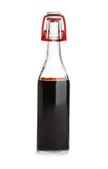 Bottle with balsamic vinegar on white background