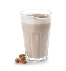Glass of protein shake and almonds isolated on white