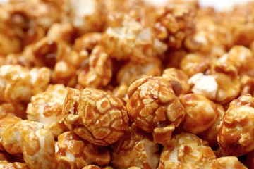 Rolgordijnen Sweet tasty caramel popcorn as background, closeup © New Africa