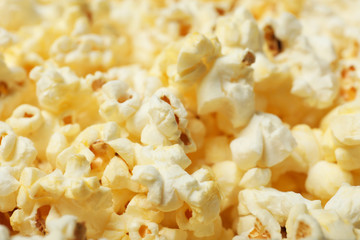 Fresh popcorn as background, closeup. Tasty snack