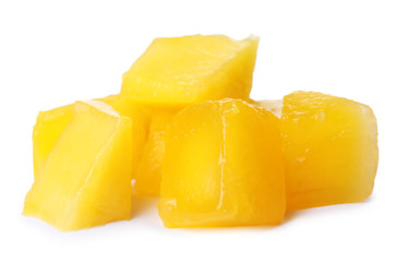 Fresh juicy mango cubes on white background