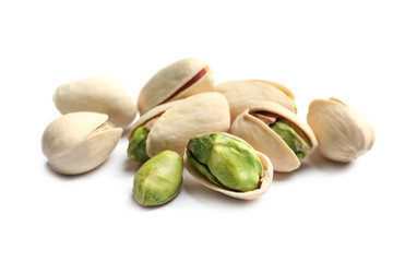 Tasty organic pistachio nuts on white background, closeup
