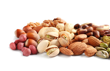 Pile of mixed organic nuts on white background