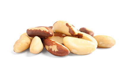 Pile of tasty Brazil nuts on white background