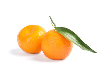 Tasty ripe tangerines on white background. Citrus fruit