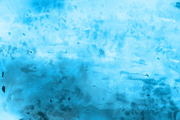 Colorful winter blue ink and watercolor textures on white paper background. Paint leaks and ombre effects. Hand painted abstract image.