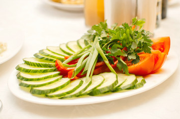 Cucumber, sensible tomatoes and fresh lettuce. Light evening dinner vegetarian.