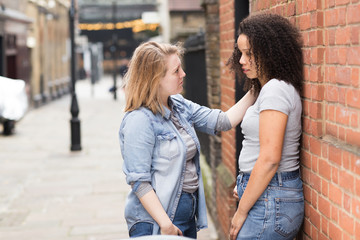 lesbian girl consoling her girlfriend