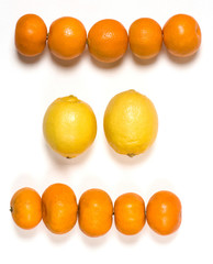 Tangerines and lemons on white background