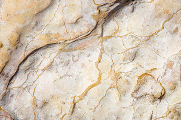 stone background with random yellow and abstract lines