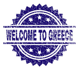 WELCOME TO GREECE stamp seal watermark with distress style. Blue vector rubber print of WELCOME TO GREECE text with grunge texture.