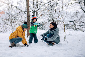 Family playing in the snow