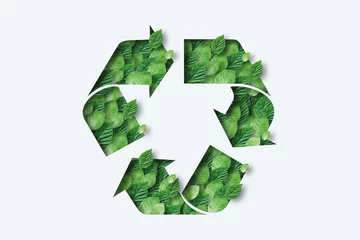 Foto op Aluminium Recycling icon made from green leaves. Light background. The concept of recycling, non-waste production, eco-plastic, eco fuel. © Aliaksandr Marko