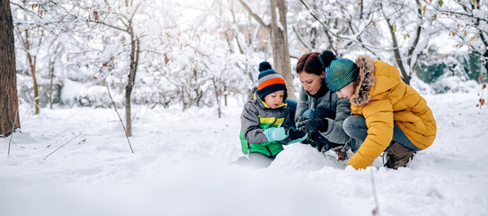 Family playing in the snow