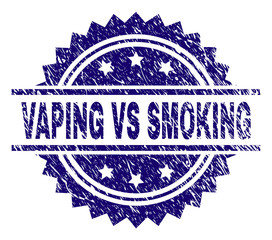 VAPING VS SMOKING stamp seal watermark with distress style. Blue vector rubber print of VAPING VS SMOKING title with unclean texture.