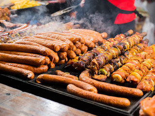 Grilled meat, sausages skewers in the bazaar, Barbeque meat stick at street christmas market