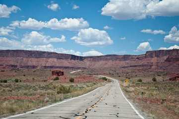 Road in American desert, sign for horseman