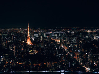 Tokyo Tower at night illuminated with a lot of light