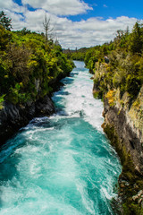 Scenic landscape view of turquoise water of Waikato river and Huka Falls,most popular natural tourist attraction/destination. Great lake Taupo,North Island, New Zealand. Summer active holiday concept.