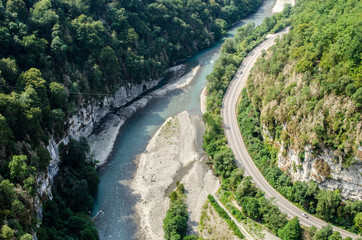 The road along the mountain river from the height