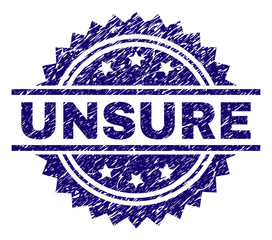UNSURE stamp seal watermark with distress style. Blue vector rubber print of UNSURE text with scratched texture.