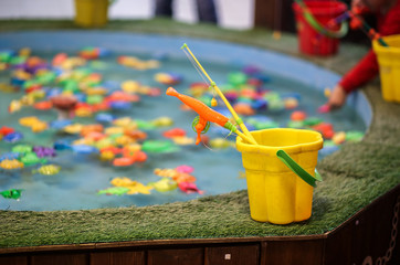 Children's fishing game with a magnet on a fishing rod.