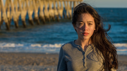 Young Asian-American at North Carolina Beach in winter