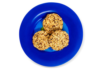 Cookies on blue plate on white background, isolated.