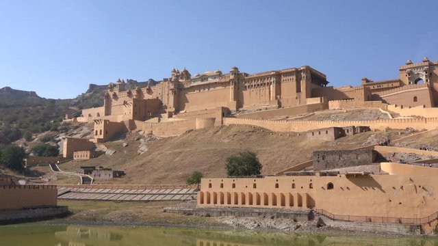 View of Amber Fort in historical city of Amer, Jaipur, Rajasthan, India, establishing shot. Famous travel destination in India