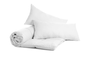 Soft blanket and pillows on white background