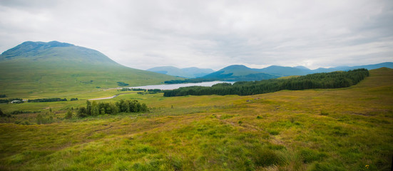 Fototapeta na wymiar Scottish landscape with hills and lakes